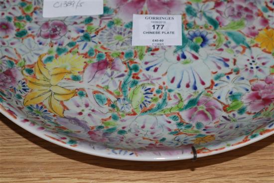 A Chinese famille rose thousand flower pattern dish, Republic period with Qianlong mark, diameter 33cm (a.f.)